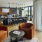 Rooftop lounge with fireplace, kitchen + dining space